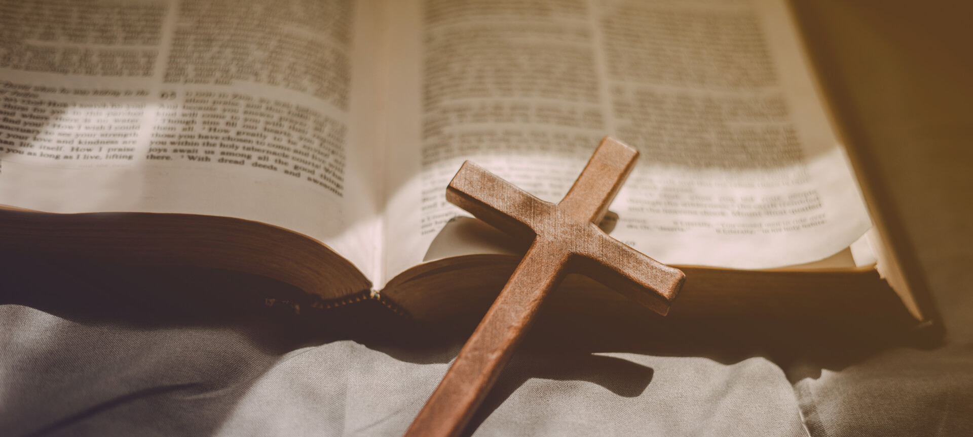 Crucifixion Of Jesus Christ ,cross With The Holy Bible At Sunlig